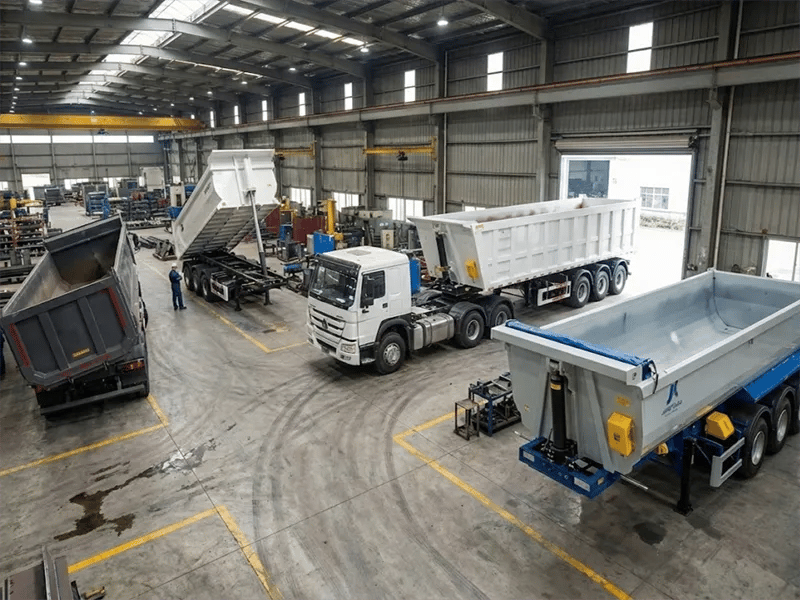 Heavy-duty rear dump semi-trailers designed for efficient sand and coal transport, displayed at the Kales Vehicle factory.