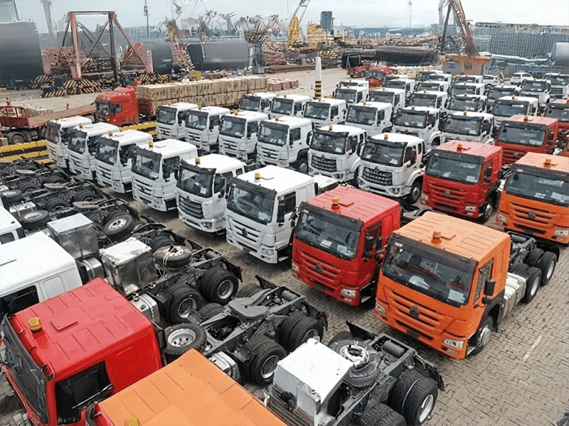 A group of kales trucks parked at the port, waiting for export.
