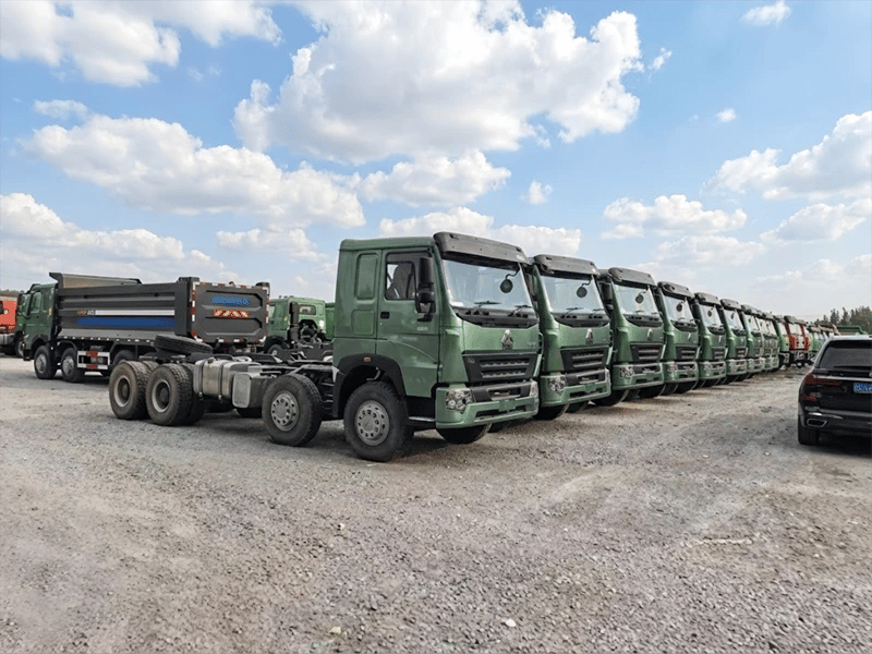 A group of kales trucks parked at the port, waiting for export.