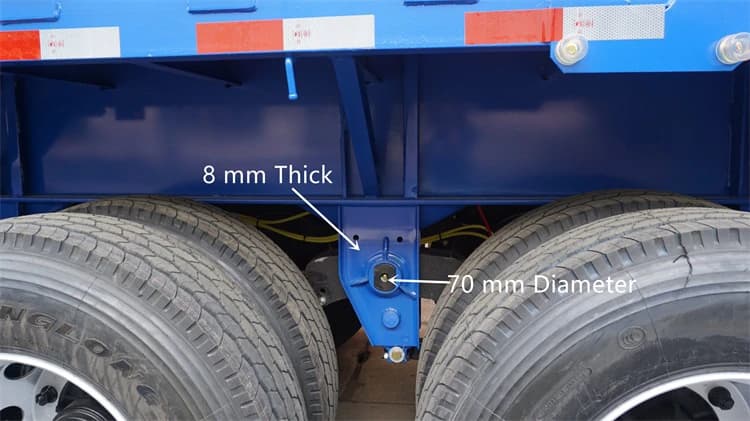 Kales dropside trailer heavy-duty suspension detail: 70mm pin, diagonal bracing reinforcement, and dual tires.