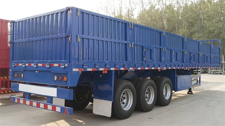 Rear 45-degree view of Kales 3-axle dropside trailer featuring detachable side walls and robust rear structure.