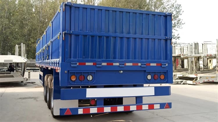 Rear detail of Kales dropside trailer featuring LED lights with protective guards, reinforced bumper, and openable tailgate.