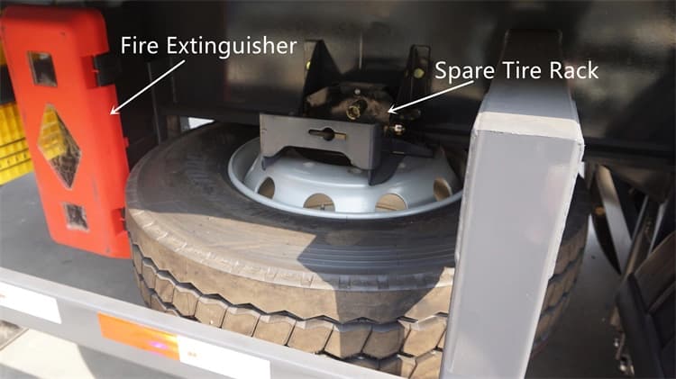 Kales 35m³ Dump Semi-Trailer accessories: spare tire carrier featuring one spare tire and fire extinguisher.