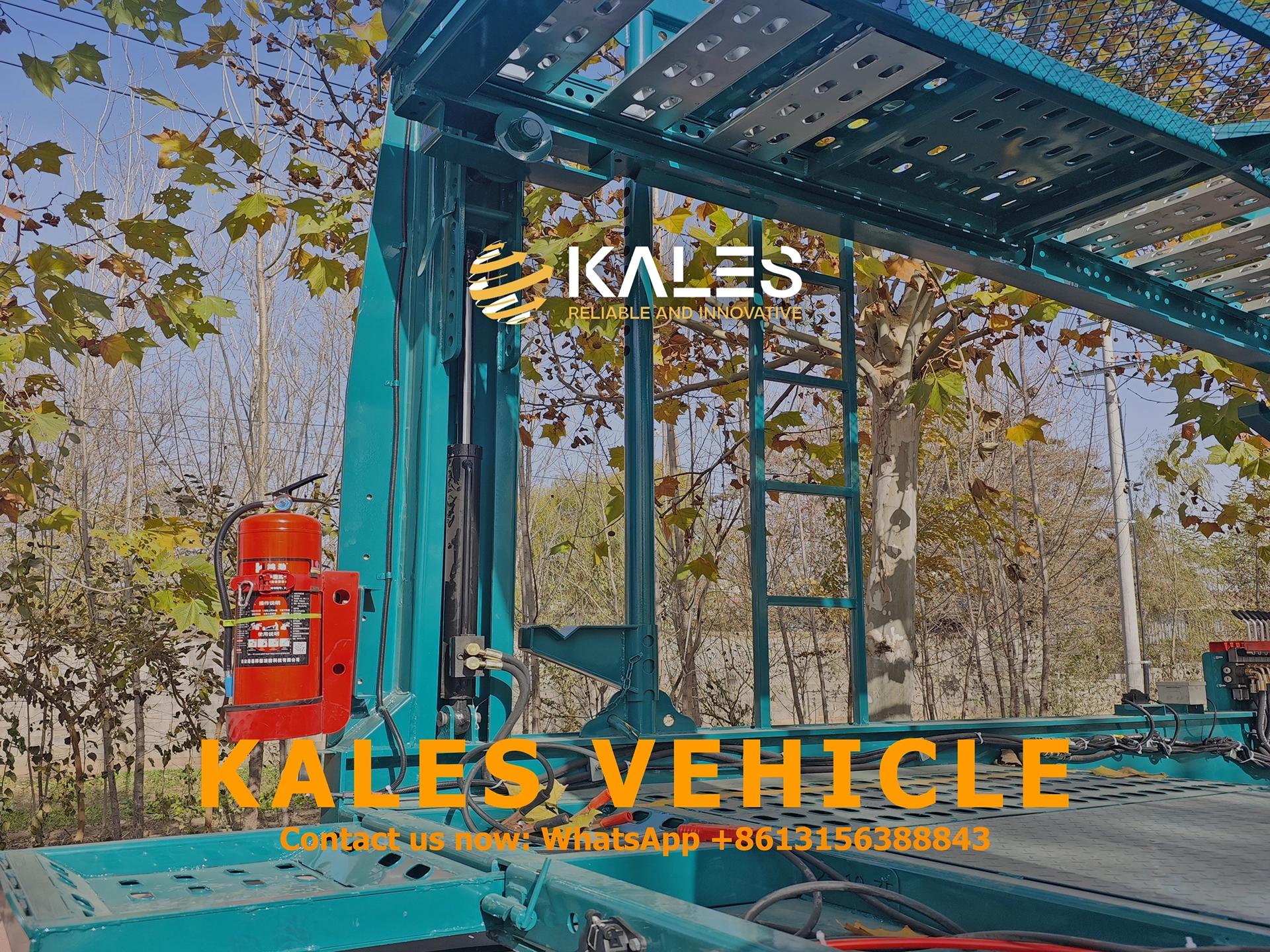 Front hydraulic lifting mechanism and safety fire extinguisher detail on Kales semi trailer.