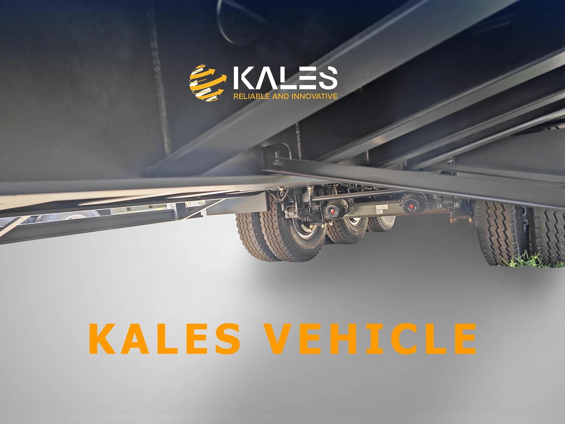 Underside view of Kales 3-axle 80 ton lowbed trailer showing reinforced steel beams and axles.