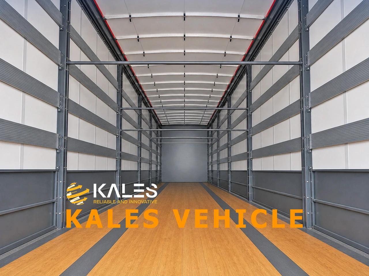 Interior view of Kales 120m³ curtain-side trailer showing 28mm anti-slip timber floor and 34 recessed cargo lashing rings