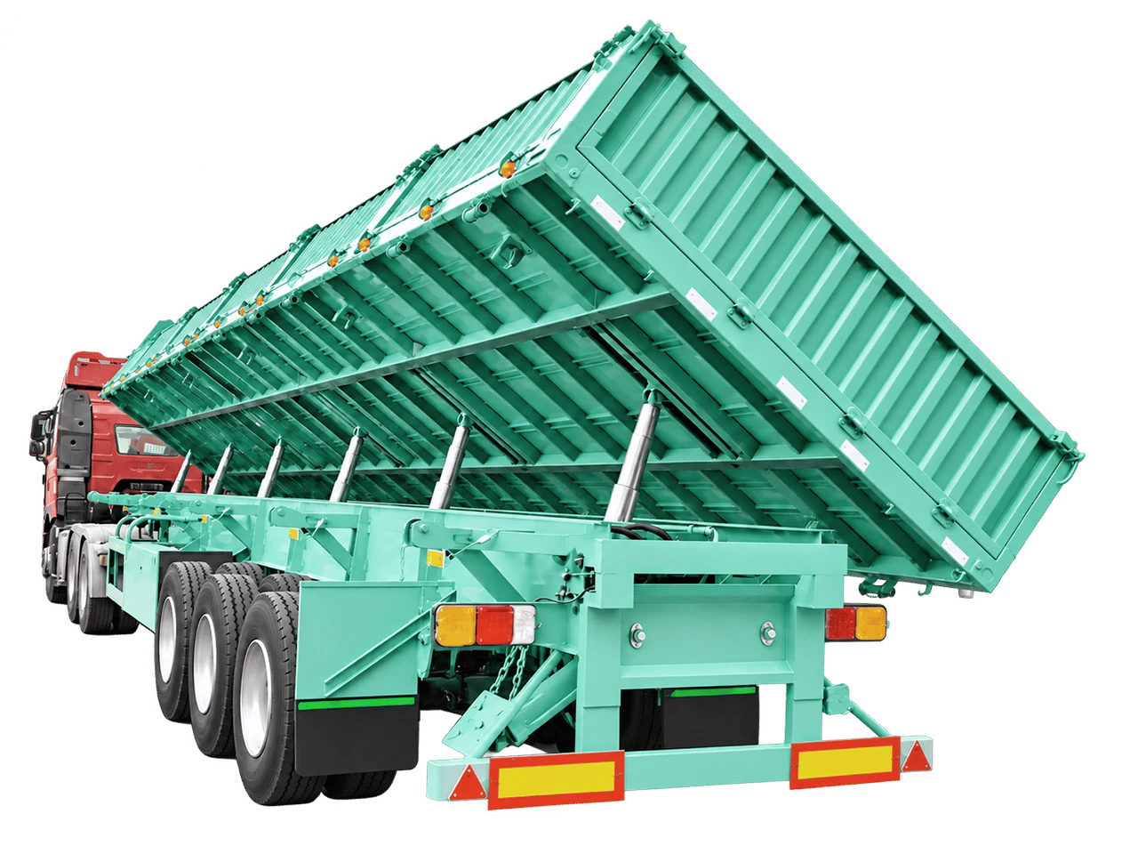 Kales 13.5m side tipper semi-trailer unloading bulk gravel on-site with automatic drop gates open