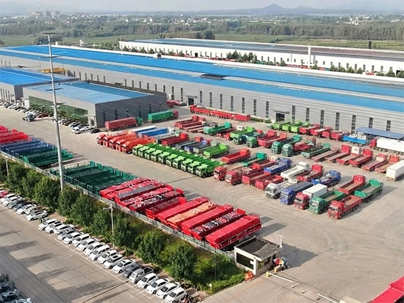 Aerial view of Kales Vehicle Co., Ltd. factory in China showing large scale production facilities and semi-trailers ready for export.
