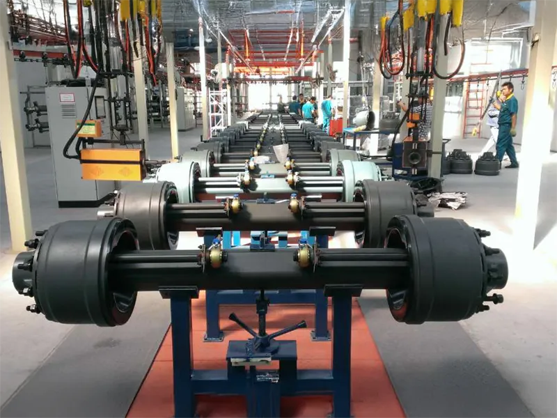 Full range of Kales Vehicle semi trailer spare parts: BPW/FUWA axles, mechanical suspension, leaf springs, and landing gears on factory floor.
