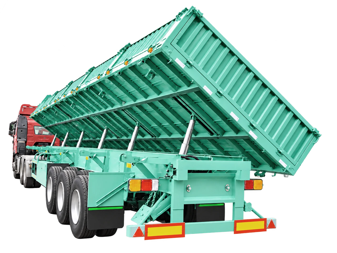 Kales 13.5m side tipper semi-trailer unloading bulk gravel on-site with automatic drop gates open